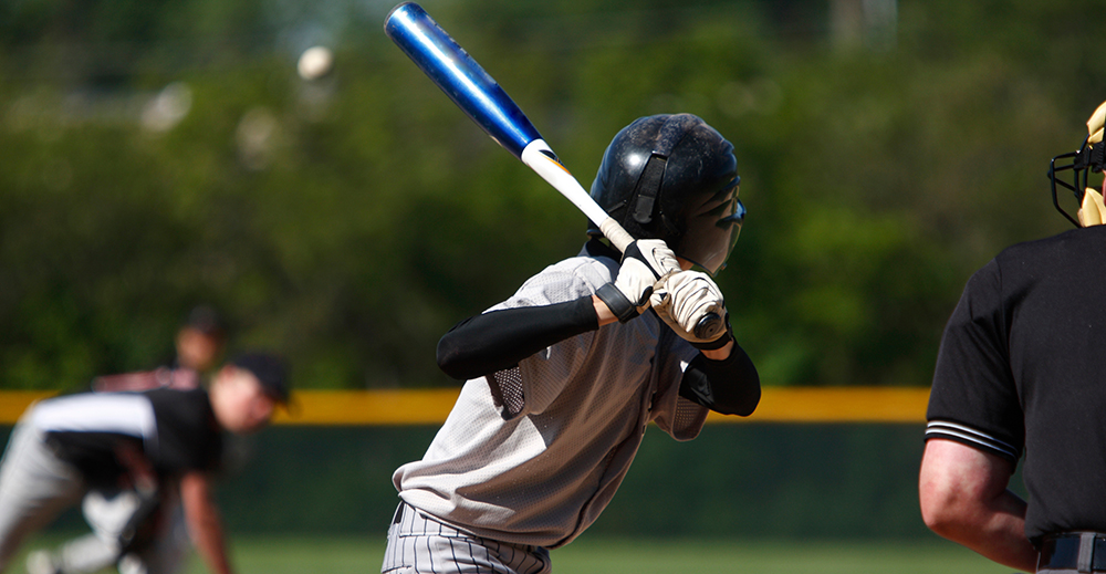 High school baseball players practicing, representing both JV and varsity teams.